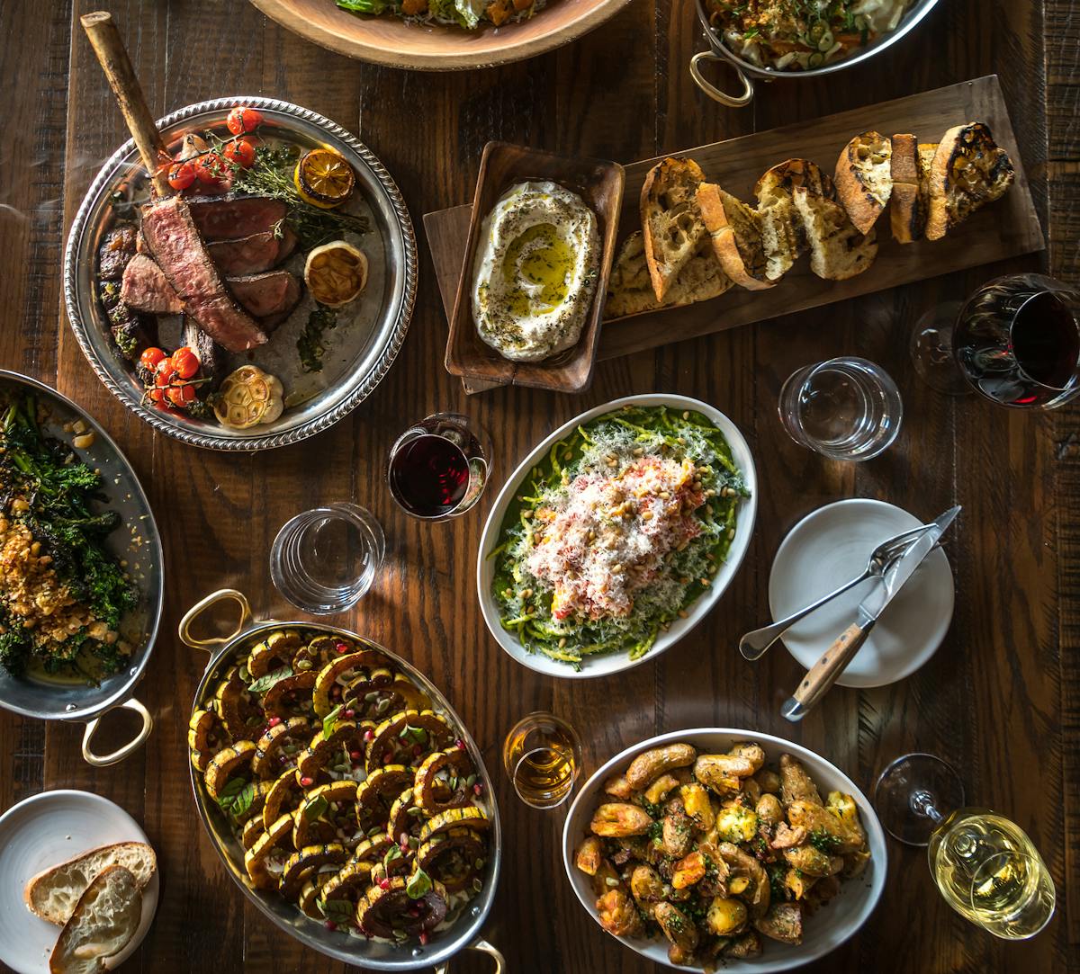 an overview of a table with multiple plates of food